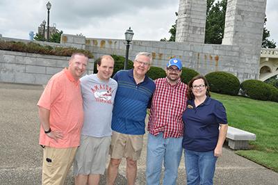 Five Alumni in Front of the memorial bridge