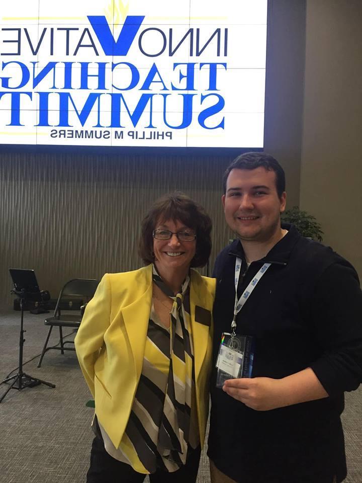 A male student posing for a photo with Hope Clausman at the Innovative Teaching Summit
